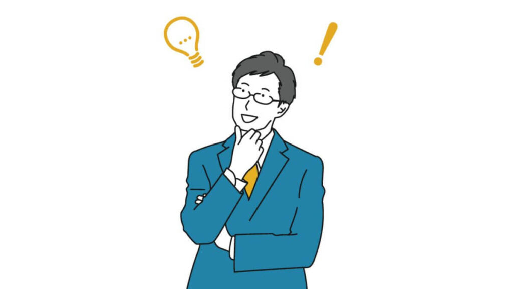 何かを思いつき笑顔のスーツ姿の男性