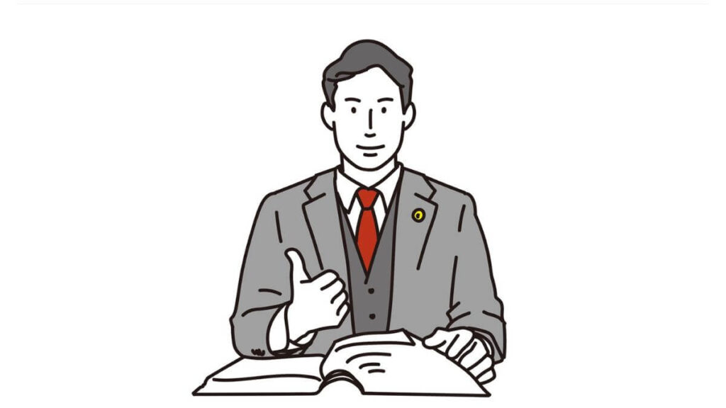 親指をあげてサインを出すスーツ姿の弁護士