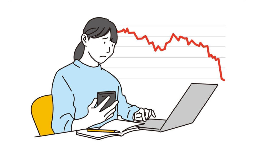 体調が悪そうに仕事をする若い女性