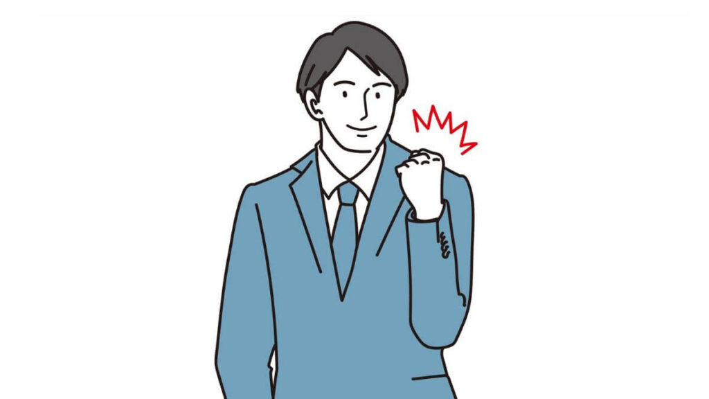 拳を上げて凛々しい表情をするスーツの男性