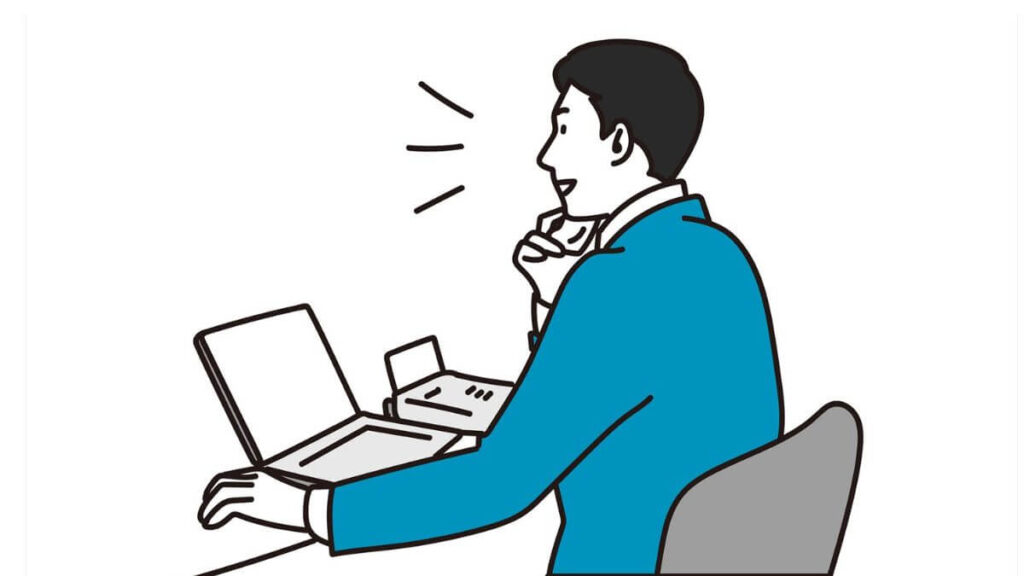 明るい表情で電話をするスーツ姿の男性