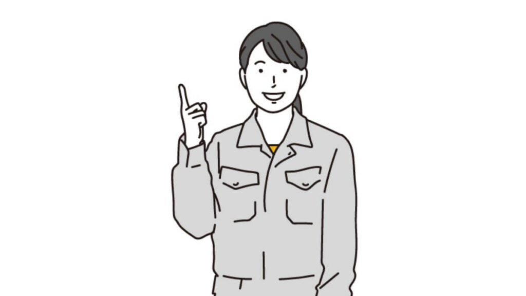 指をあげて説明をする作業着姿の女性