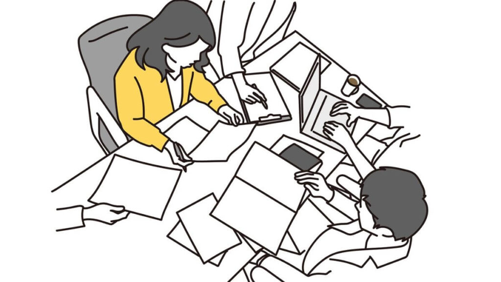 仕事をするスーツ姿の男女