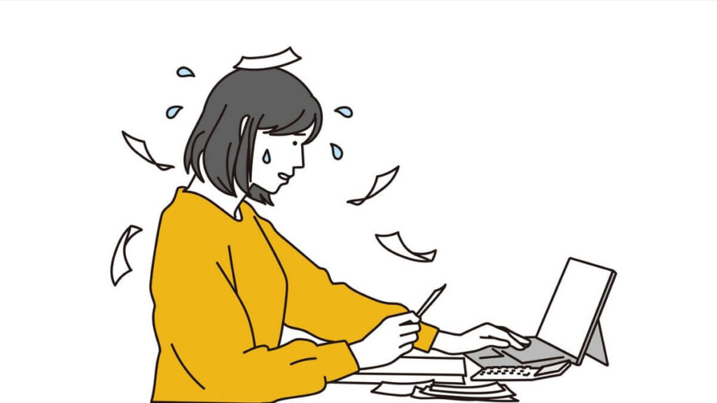 焦りながらパソコン作業をするキャリアウーマン