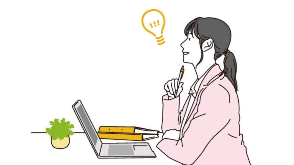 パソコン仕事中に何かをひらめいた女性