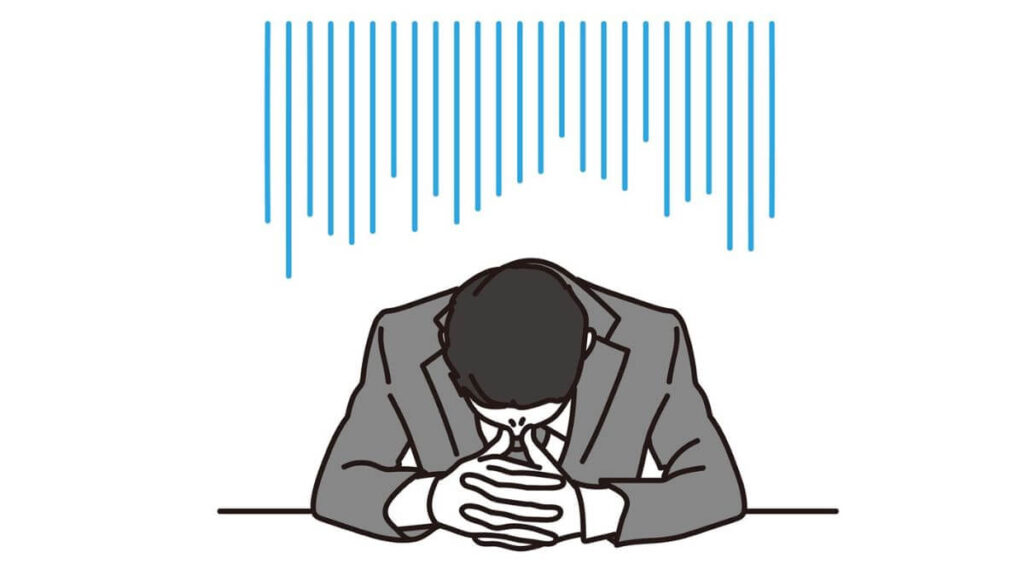 落ち込み肩を落とすスーツ姿の男性