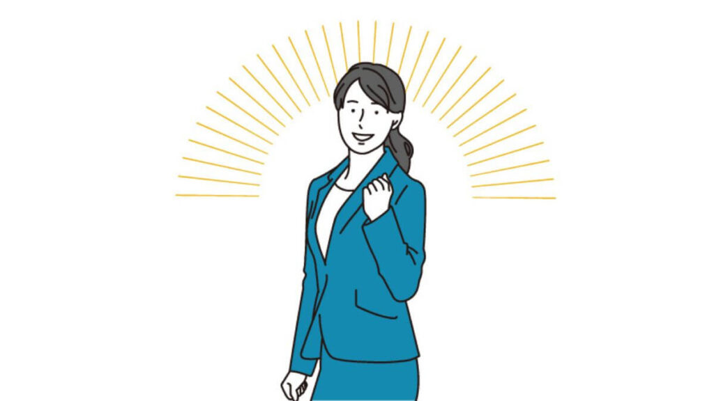 拳を上げて明るい表情をするスーツ姿の女性