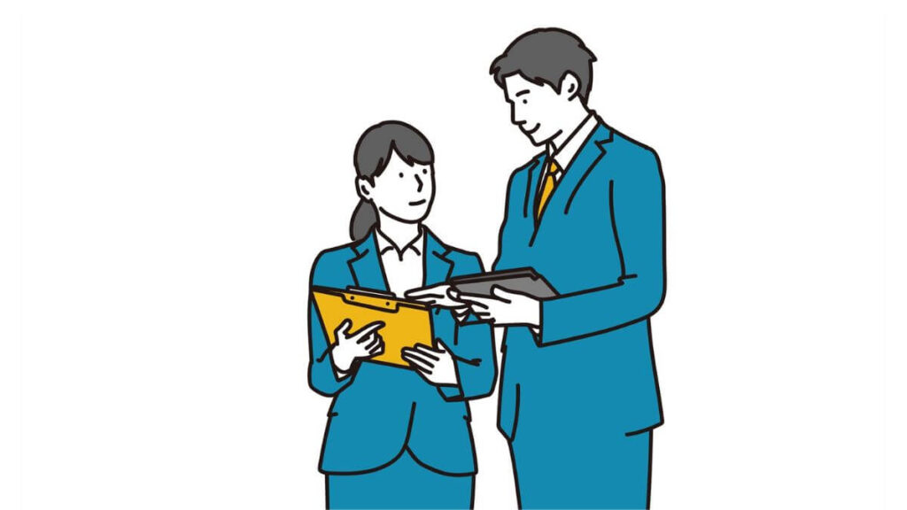仕事についての話をするスーツ姿の男女2人