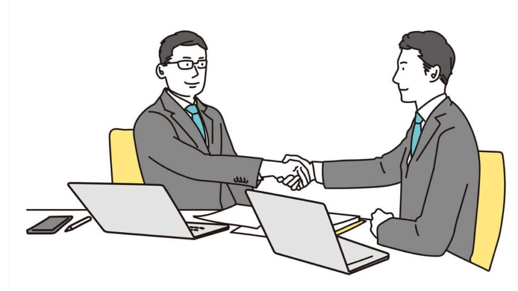 笑顔で握手を交わすスーツ姿の男性2人