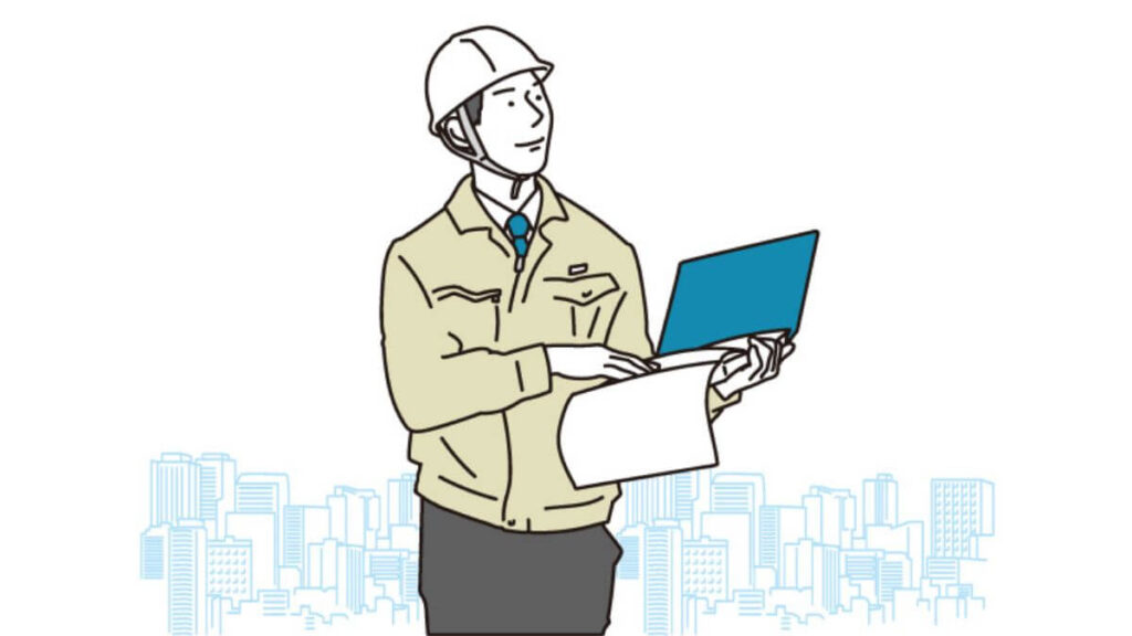 バインダーを持ち仕事をする作業着姿の男性