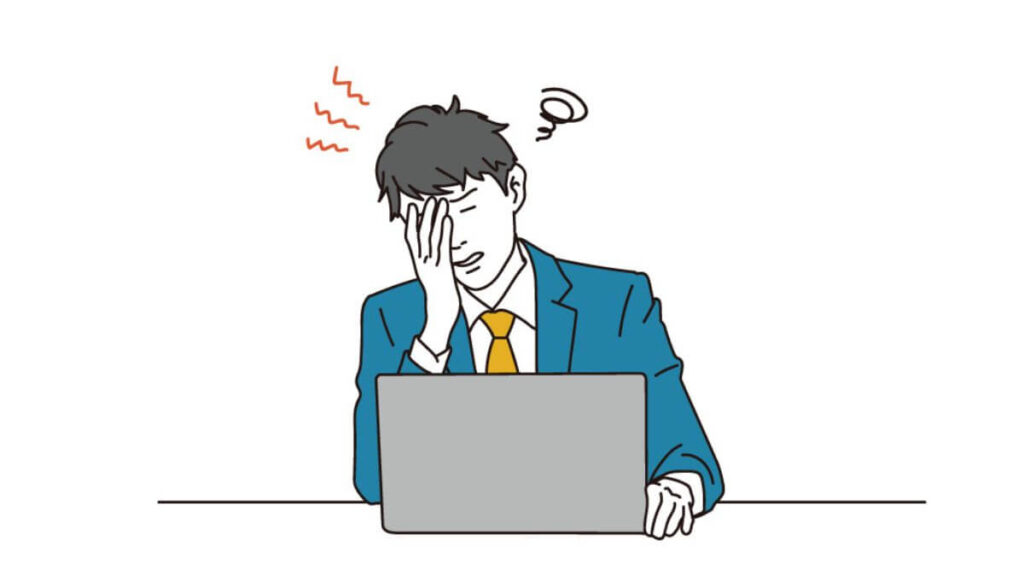 パソコンまで葛藤するスーツ姿の男性