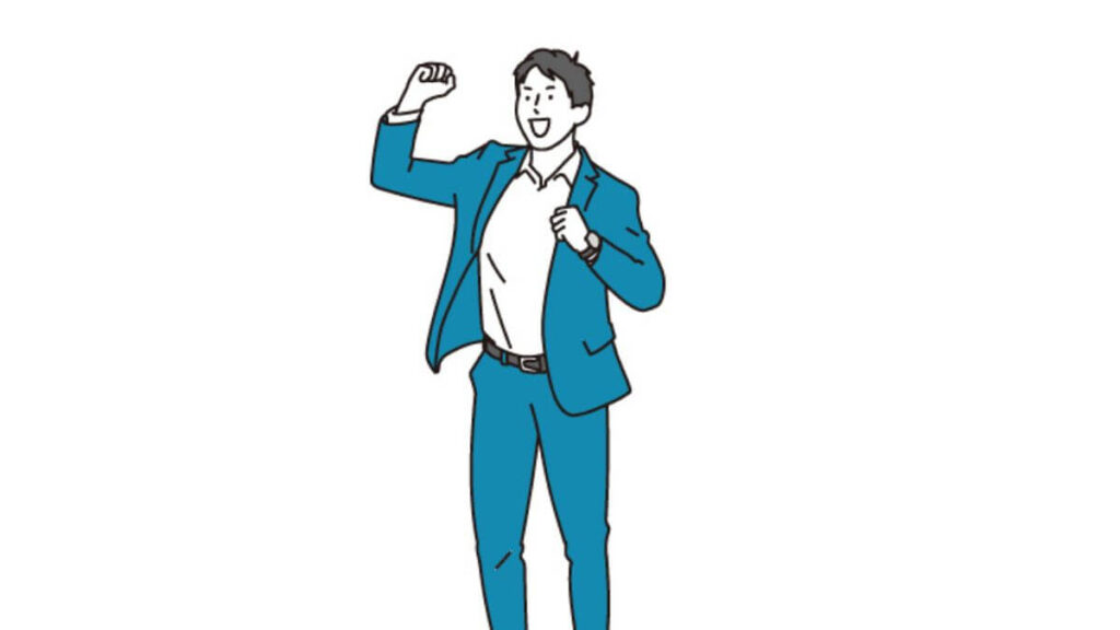 ガッツポーズをするスーツ姿の男性
