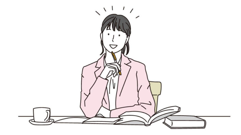 ペンを顎に当て何かを閃いた若い女性