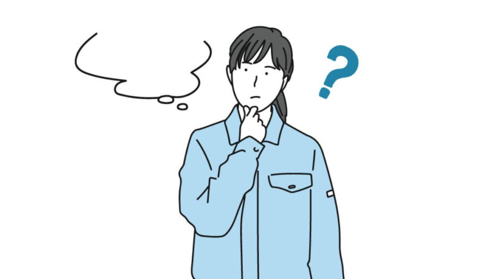 疑問を感じる作業着姿の女性