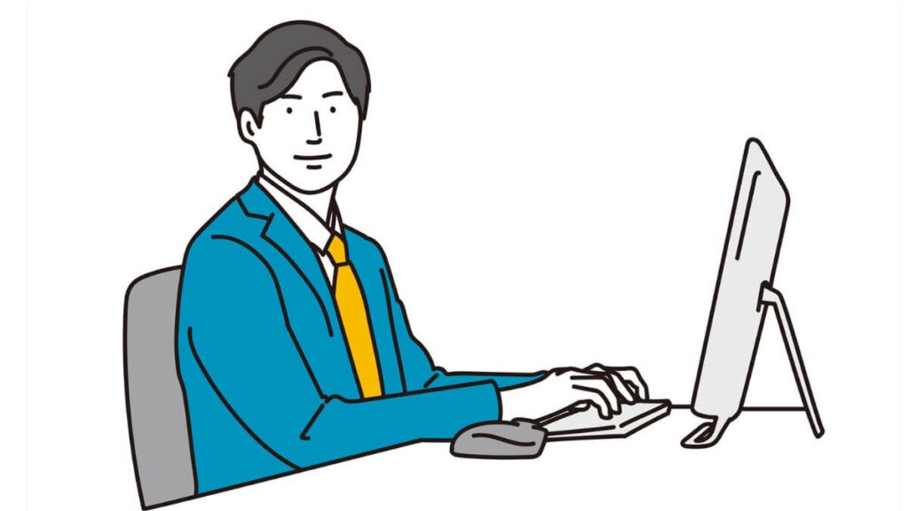 笑顔でパソコン作業をするスーツ姿の男性