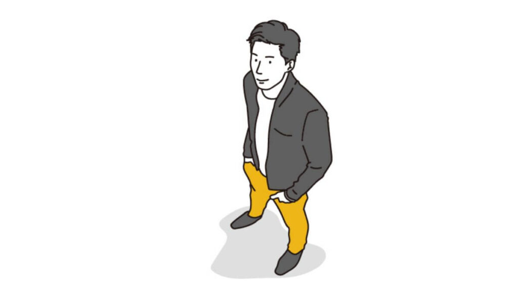 明るい表情で上を見上げる若い男性