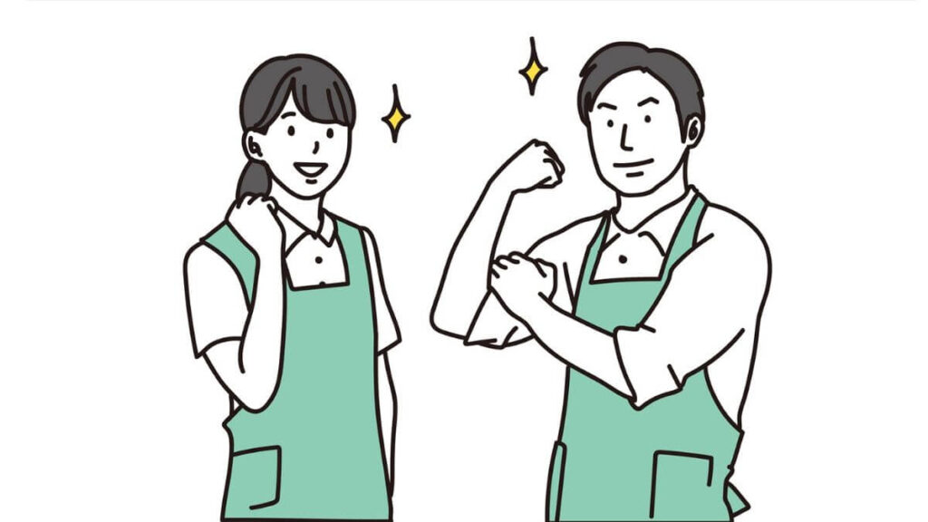 やる気を見せる作業着姿の男女2人