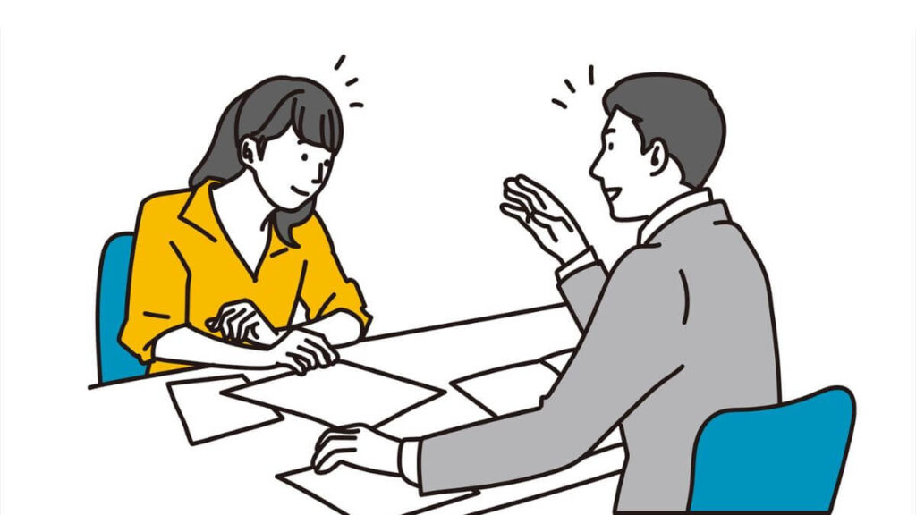 上司に相談する若い女性