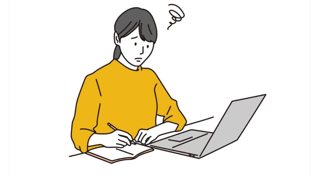 困惑しながらも仕事をする若い女性