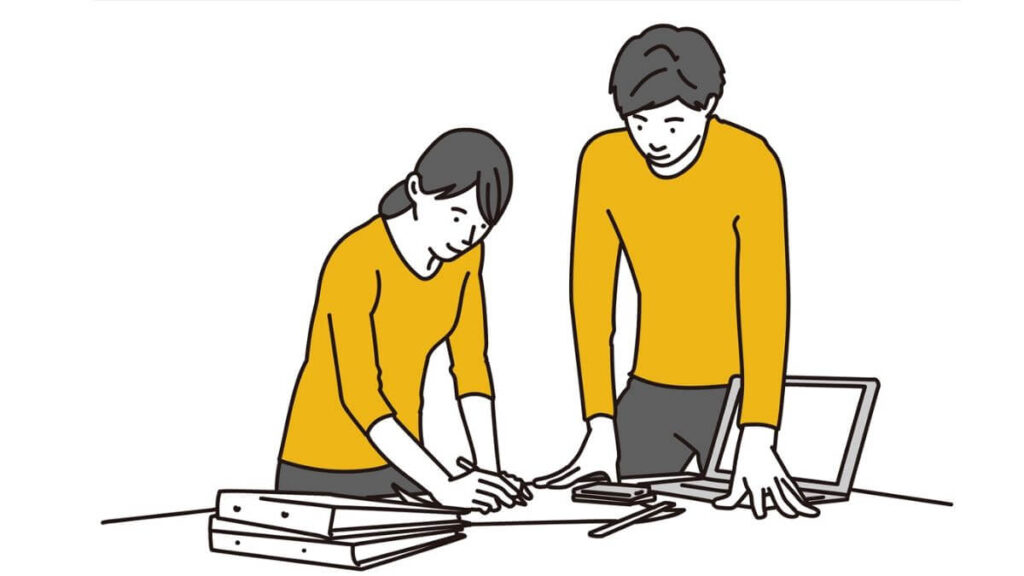 立ったまま会議をする男女