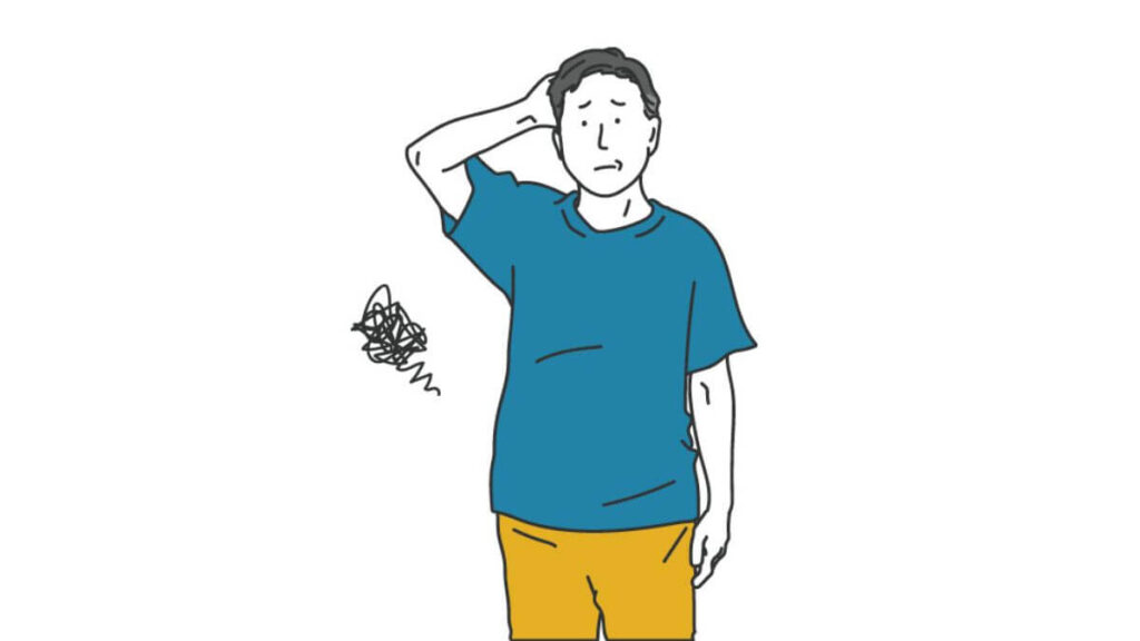 頭に手を置き困った表情をする男性