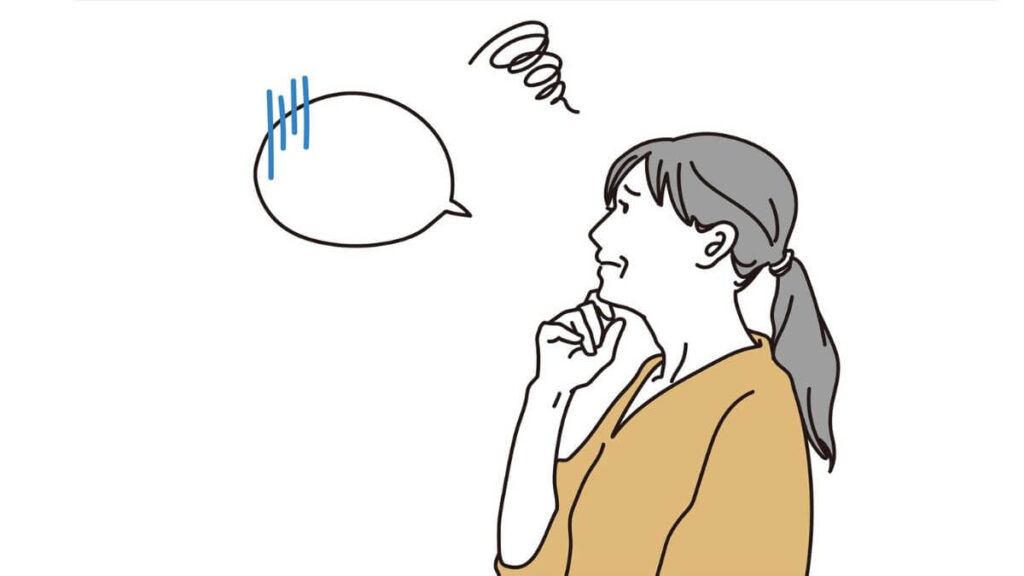 上を向き困った表情をする女性