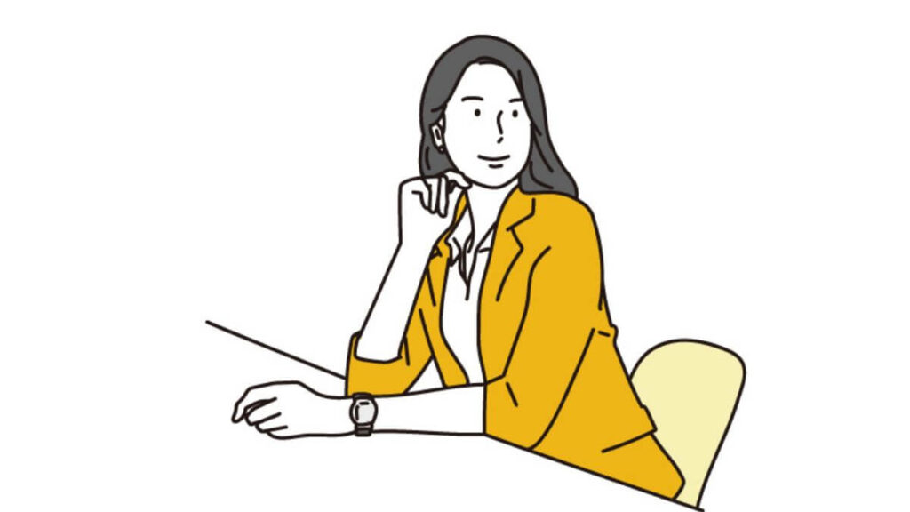 机の前で会話をするスーツ姿の女性