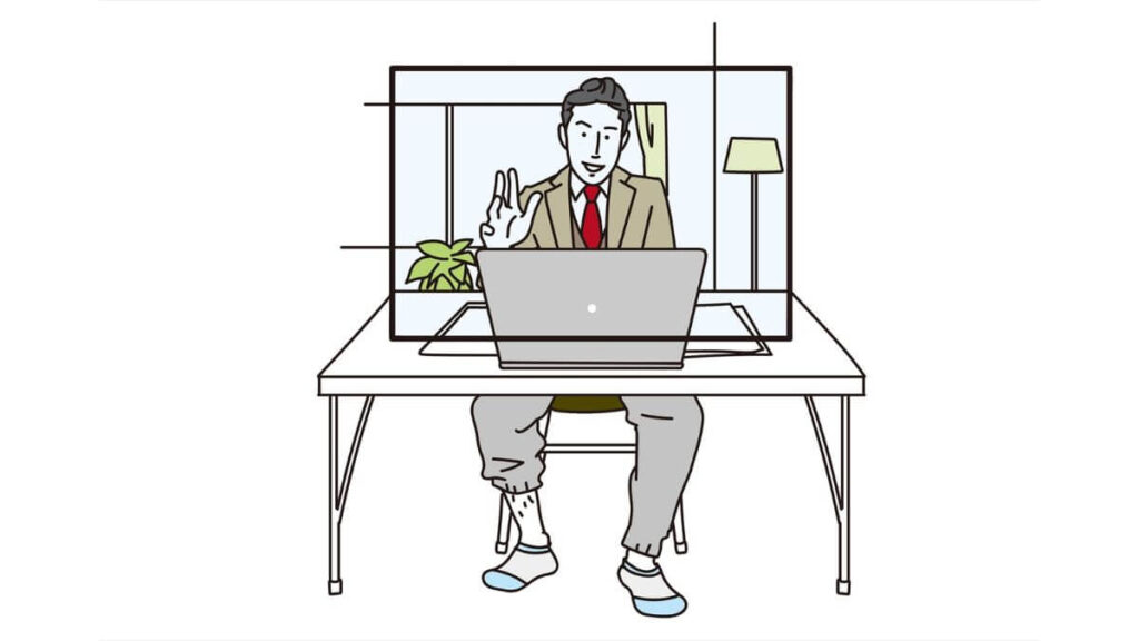 自宅でリモート会議をするスーツの男性