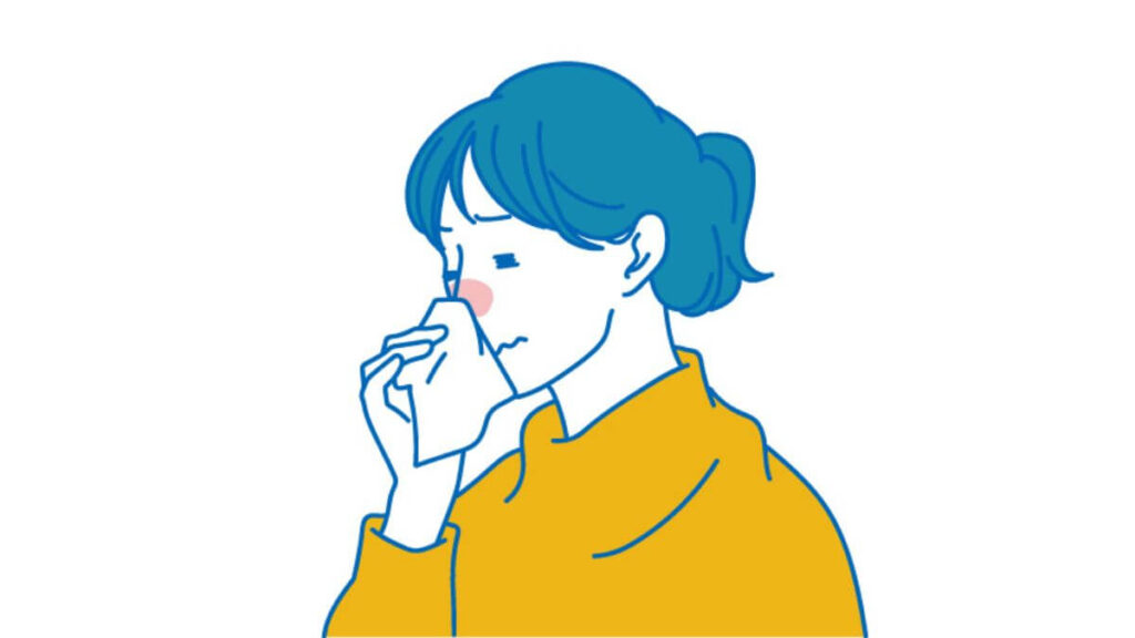 鼻をかみ泣いている若い女性