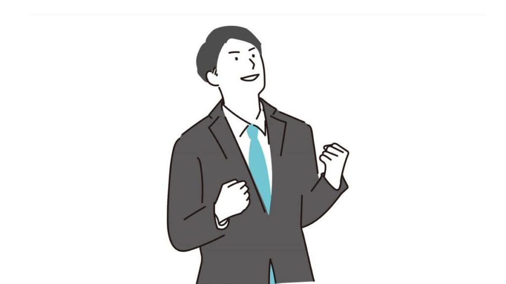 ガッツポーズをして喜ぶスーツ姿の男性
