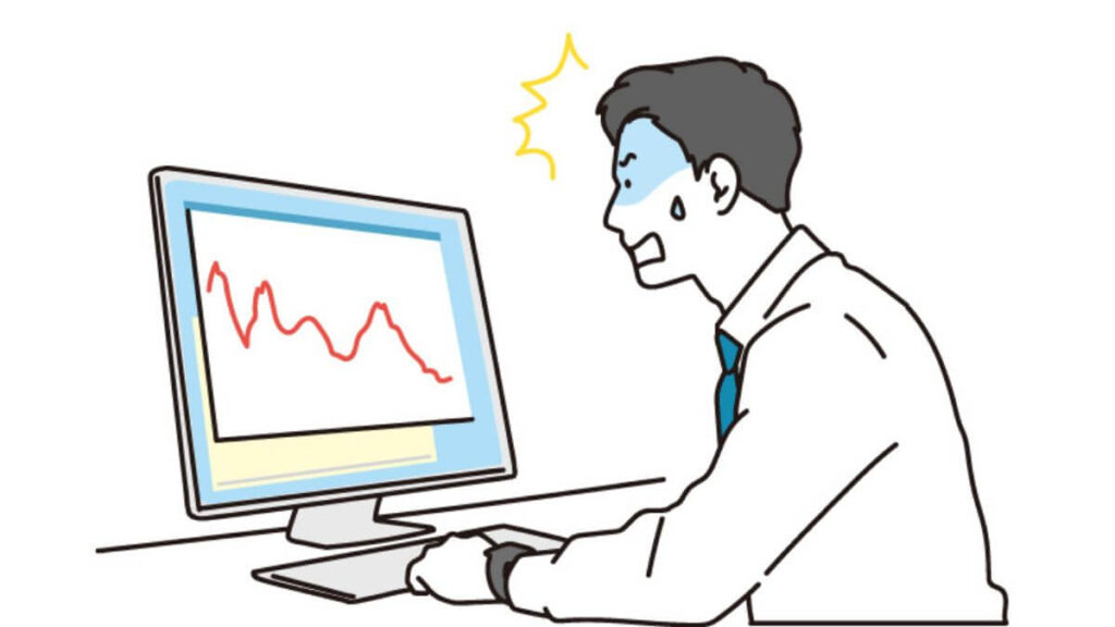 パニックになりながらパソコンを操作する男性