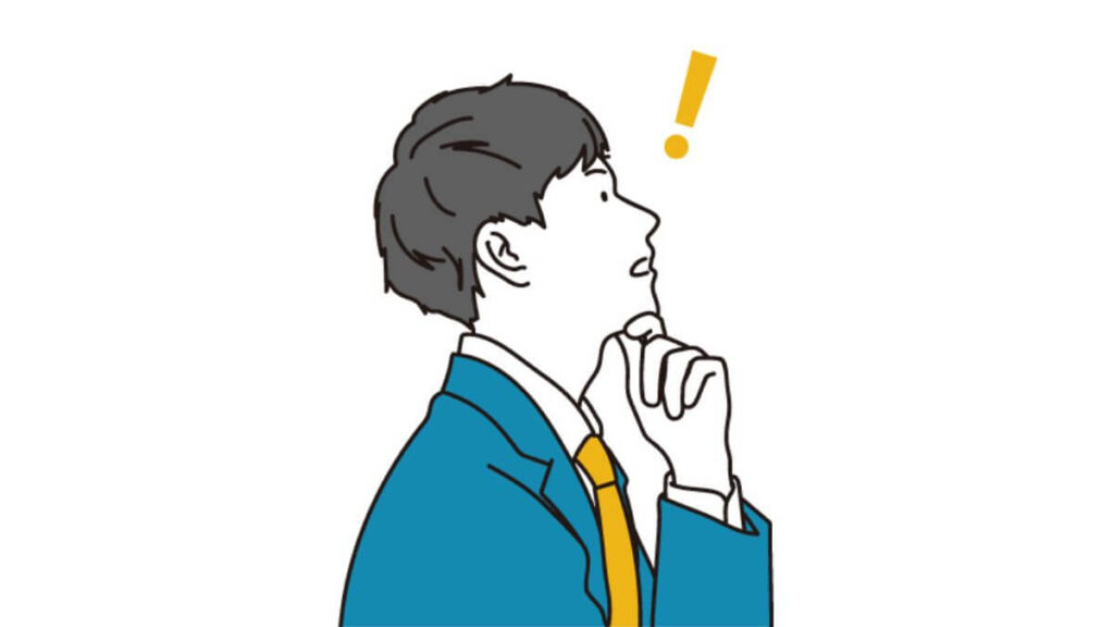 顎に手を置いて考えるスーツ姿の男性