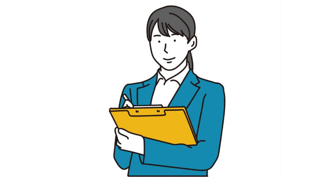 バインダーを持ちメモをするスーツ姿の女性