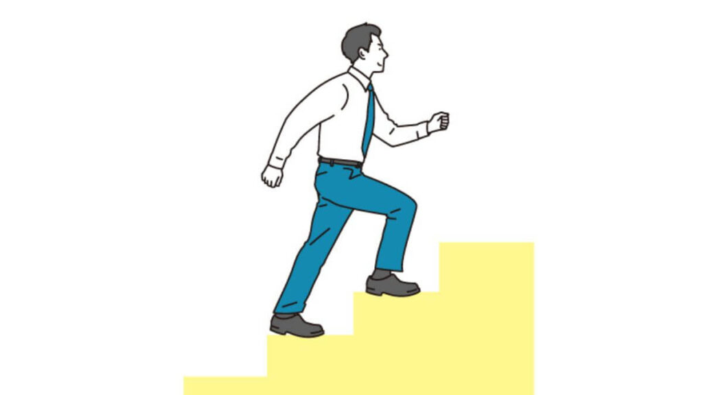 階段を登るスーツ姿の男性