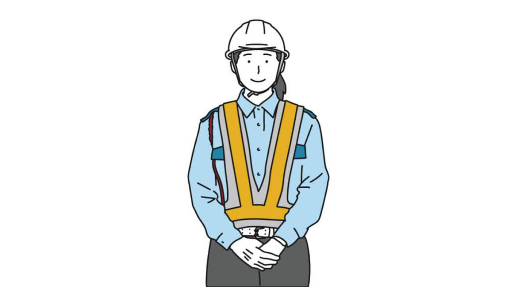 前で手を組み笑顔の作業着姿の女性