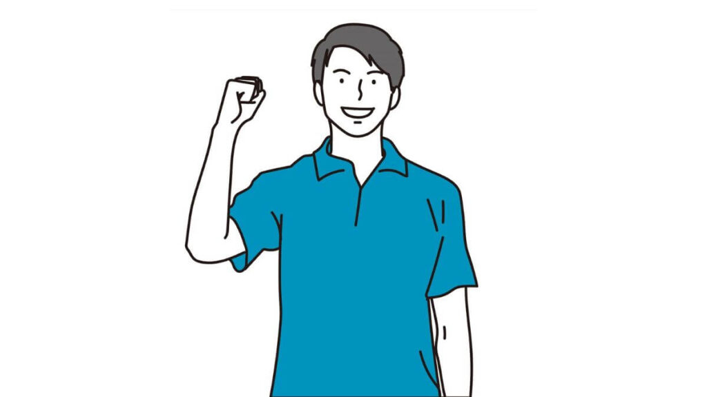 ガッツポーズをする若い男性