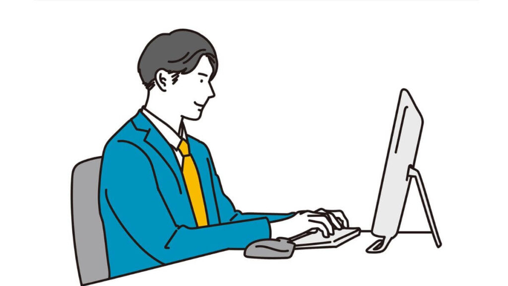 パソコン作業をするスーツ姿の若い男性