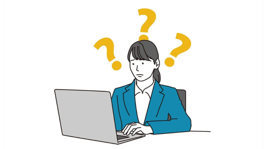 疑問を持ちながら仕事をするスーツ姿の女性