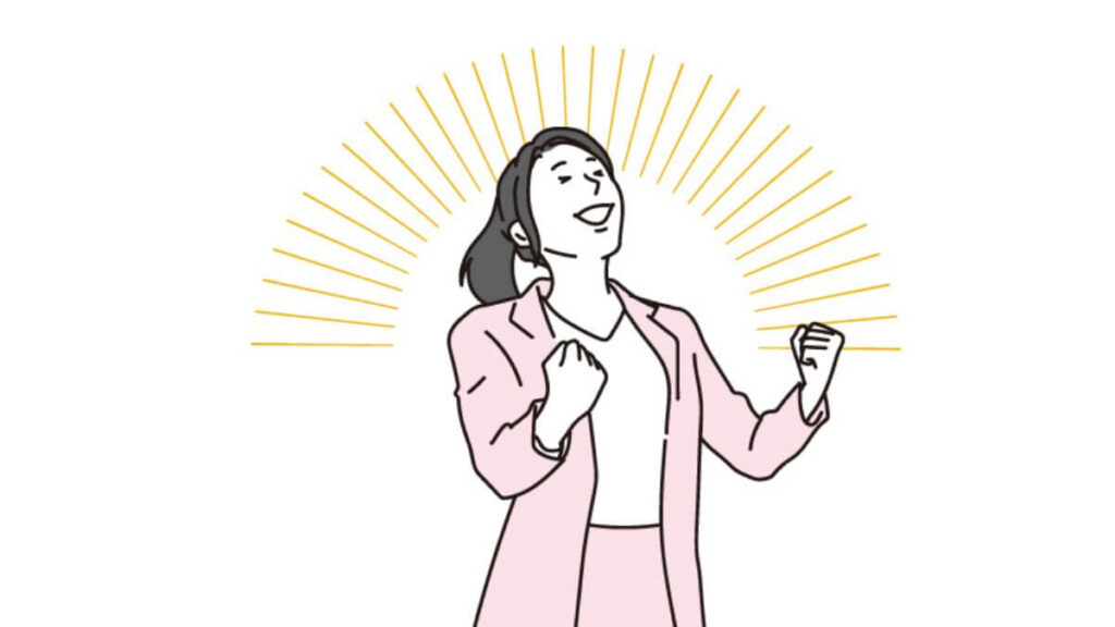 ガッツポーズをするスーツ姿の女性