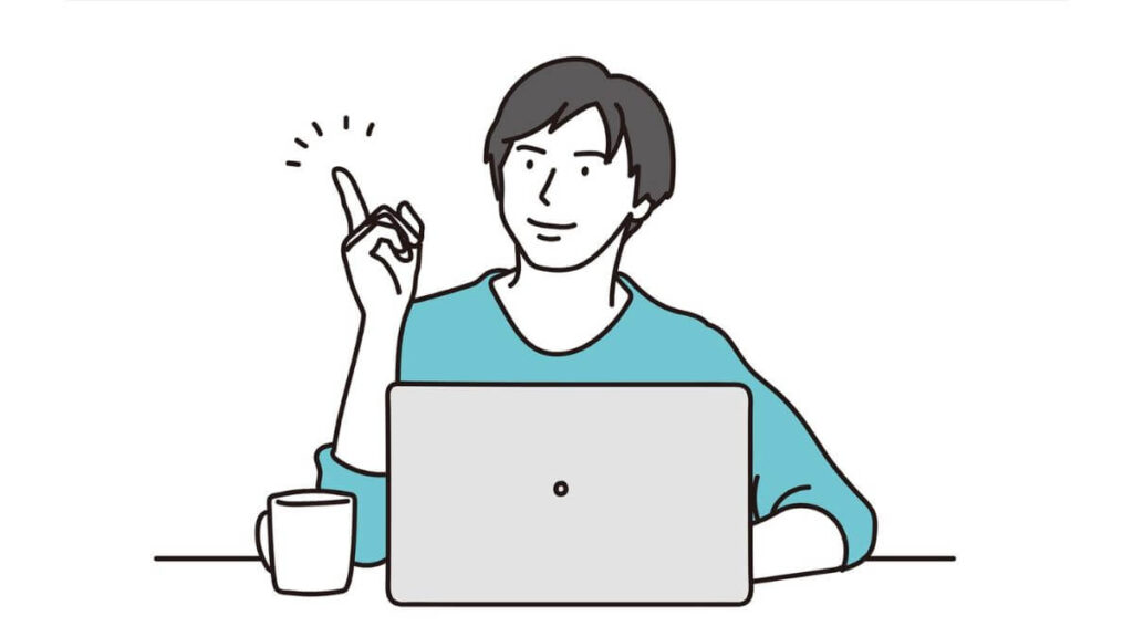 パソコン作業中に指を上げる若い男性