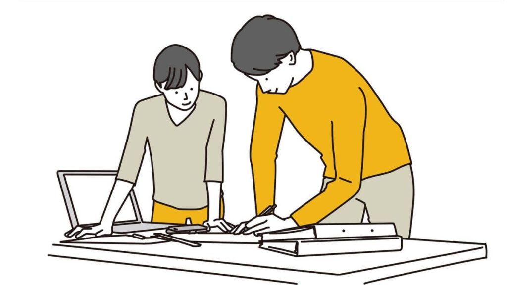 立ちながら仕事をする男女2人