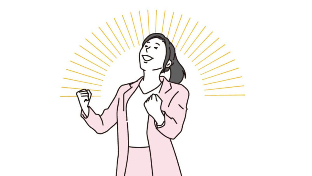 ガッツポーズをする若いキャリアウーマン