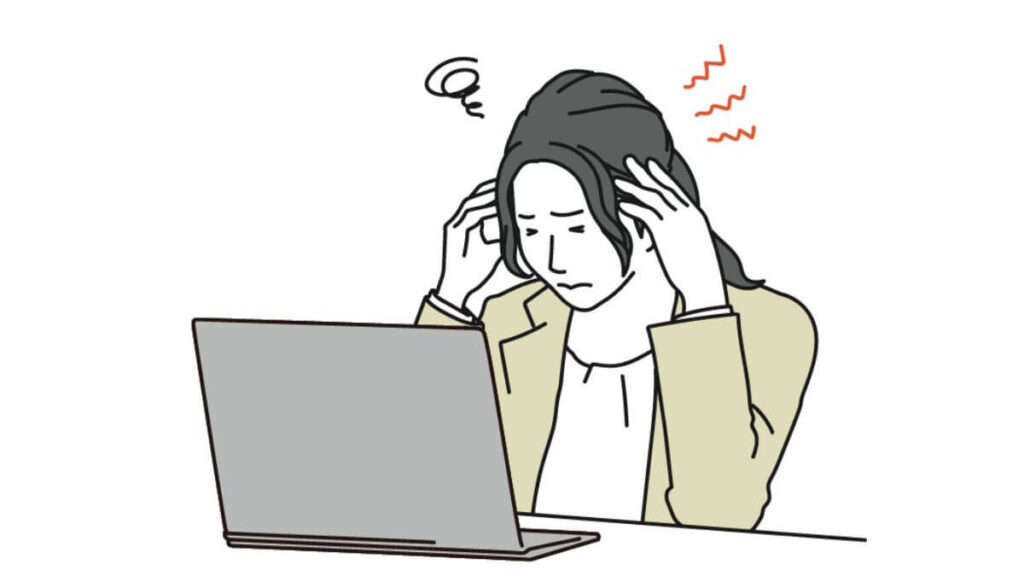 頭痛を感じながら仕事をするキャリアウーマン