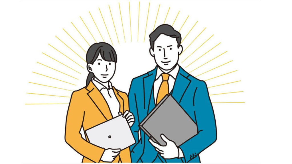 パソコンを抱えやる気のある表情をする男女