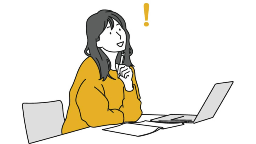 パソコンの前で何かを閃くキャリアウーマン