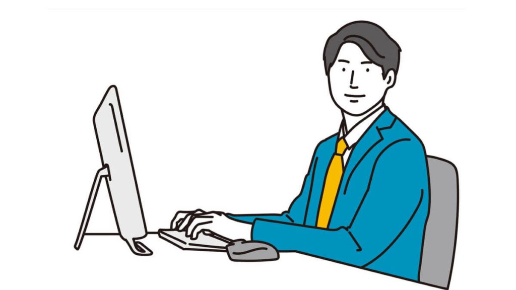 笑顔でパソコン作業をするサラリーマン